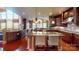 Open concept kitchen with a large center island, custom cabinets, stainless steel appliances, and ample counter space at 708 Ridgelake Dr, Weddington, NC 28104