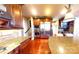 Gourmet kitchen showcasing stainless steel appliances, granite counters, custom cabinets, and hardwood flooring at 708 Ridgelake Dr, Weddington, NC 28104