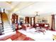 Elegant living room showcasing hardwood floors, a staircase, and a leather furniture set beneath recessed lighting at 708 Ridgelake Dr, Weddington, NC 28104