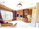 Comfortable living space with built-in cabinets, a large window, and a cozy seating arrangement at 708 Ridgelake Dr, Weddington, NC 28104