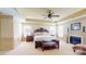 Serene main bedroom with neutral tones, tray ceiling, a fireplace, and cozy seating at 708 Ridgelake Dr, Weddington, NC 28104