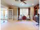 Large office area with french doors, accent wallpaper, and dedicated built in storage at 708 Ridgelake Dr, Weddington, NC 28104