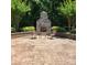 Inviting outdoor patio features a brick fireplace and seating area, perfect for relaxation and entertaining at 708 Ridgelake Dr, Weddington, NC 28104