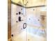 Shower features tile, a bench, black accents, and a glass door at 708 Ridgelake Dr, Weddington, NC 28104
