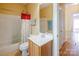 Bathroom featuring a tub and shower, a single sink vanity, and a toilet at 734 E 10Th St, Charlotte, NC 28202
