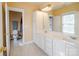 Spacious bathroom with double vanity, a toilet in its own room, and bright lighting at 734 E 10Th St, Charlotte, NC 28202