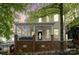 Charming two-story home with a welcoming front porch, brick base and ample natural light at 734 E 10Th St, Charlotte, NC 28202