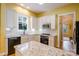 Bright kitchen with white cabinets, granite countertops, and modern stainless steel appliances at 734 E 10Th St, Charlotte, NC 28202