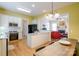 Eat-in kitchen features white cabinets, granite countertops, and stainless appliances at 734 E 10Th St, Charlotte, NC 28202