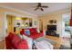 Open-concept living room featuring a red couch and a clear view of the kitchen at 734 E 10Th St, Charlotte, NC 28202