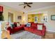Cozy living room with red sofas and open to a view of the adjacent kitchen at 734 E 10Th St, Charlotte, NC 28202
