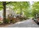 Charming neighborhood street showcasing well-maintained homes with lush greenery and street parking at 734 E 10Th St, Charlotte, NC 28202