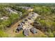 Aerial shot of new construction neighborhood surrounded by mature trees and pristine landscaping in a cul-de-sac at 7500 Happy Hollow Dr, Mint Hill, NC 28227
