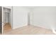 Bright bedroom with wood floors and two doorways at 7500 Happy Hollow Dr, Mint Hill, NC 28227