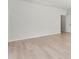 Neutral bedroom featuring light hardwood floors and a door to another room at 7500 Happy Hollow Dr, Mint Hill, NC 28227