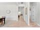 Inviting foyer featuring hardwood floors, elegant molding, and an open view into the living spaces at 7500 Happy Hollow Dr, Mint Hill, NC 28227