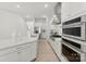 Bright kitchen features an island with stainless steel appliances and sleek countertops at 7500 Happy Hollow Dr, Mint Hill, NC 28227