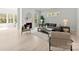 Bright living room featuring a fireplace, neutral tones, and ample seating space, with backyard views at 7500 Happy Hollow Dr, Mint Hill, NC 28227