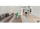 Open concept living room showcasing modern furnishings and views of a modern kitchen space at 7500 Happy Hollow Dr, Mint Hill, NC 28227