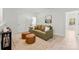 The living room offers a comfortable couch, warm lighting, and access to other areas of the house at 7500 Happy Hollow Dr, Mint Hill, NC 28227