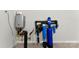 Rinnai tankless water heater and aquasana water filter system are installed on the wall at 7500 Happy Hollow Dr, Mint Hill, NC 28227