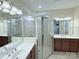 Spacious bathroom with double vanity, tiled shower, and ample natural light at 7581 Short Putt Ct, Charlotte, NC 28215