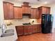 Beautiful kitchen featuring granite countertops, tile backsplash, and dark wood cabinetry at 7581 Short Putt Ct, Charlotte, NC 28215