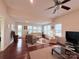 Spacious living room features wood flooring and lots of windows at 7581 Short Putt Ct, Charlotte, NC 28215
