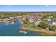 Stunning aerial view of waterfront property with docks and lush green landscape at 7844 Village Harbor Dr, Cornelius, NC 28031