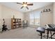 Well-lit bedroom featuring a bookshelf, musical instruments, and a window with natural light at 7844 Village Harbor Dr, Cornelius, NC 28031
