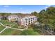 Beautiful condominium complex with lush landscaping and a refreshing pool at 7844 Village Harbor Dr, Cornelius, NC 28031