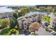 Aerial view of condominium complex with mature trees and lakeside access at 7844 Village Harbor Dr, Cornelius, NC 28031