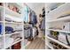 Organized walk-in closet with built-in shelving and ample storage space for clothes and accessories at 7844 Village Harbor Dr, Cornelius, NC 28031