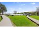 Lakeside property with manicured lawns and a charming wooden boardwalk at 7844 Village Harbor Dr, Cornelius, NC 28031
