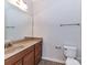 A full bathroom features a granite-topped vanity and a toilet, all with neutral walls and tile at 7854 Springs Village Ln, Charlotte, NC 28226