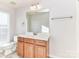 Bathroom featuring modern vanity and fixtures at 7854 Springs Village Ln, Charlotte, NC 28226