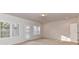 Bedroom featuring natural light, neutral carpet and white trim at 7854 Springs Village Ln, Charlotte, NC 28226