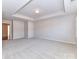 Spacious bedroom with neutral carpet and a trey ceiling at 7854 Springs Village Ln, Charlotte, NC 28226