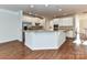 Spacious kitchen island with granite countertops and ample cabinet storage at 7854 Springs Village Ln, Charlotte, NC 28226