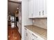 Kitchen counter and cabinets with granite countertops and hardwood floors at 7854 Springs Village Ln, Charlotte, NC 28226