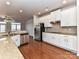 Open concept kitchen with stainless steel appliances and granite countertops at 7854 Springs Village Ln, Charlotte, NC 28226
