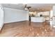 Open concept living room and kitchen with hardwood flooring and plenty of natural light at 7854 Springs Village Ln, Charlotte, NC 28226