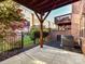 Cozy back patio with a wood roof and steel fence, perfect for outdoor lounging at 7854 Springs Village Ln, Charlotte, NC 28226