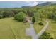 Expansive property featuring mature trees, lush lawn and a circular driveway at 807 And 809 Sparrow Springs Rd, Kings Mountain, NC 28086