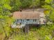 View of a home with a large deck, chairs, and grill, perfect for entertaining or relaxing outdoors at 807 And 809 Sparrow Springs Rd, Kings Mountain, NC 28086