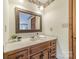 Bathroom with vanity sink with a large framed mirror and under-sink storage at 807 And 809 Sparrow Springs Rd, Kings Mountain, NC 28086