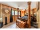 Elegant bedroom featuring a four-poster bed, wood paneling, and a comfortable design at 807 And 809 Sparrow Springs Rd, Kings Mountain, NC 28086