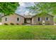 Charming brick home featuring a lush lawn, well-manicured landscaping and stylish shutters at 807 And 809 Sparrow Springs Rd, Kings Mountain, NC 28086
