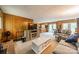 Cozy living room featuring wood paneling, plush seating, and an open floor plan to the kitchen at 807 And 809 Sparrow Springs Rd, Kings Mountain, NC 28086