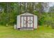Storage shed with double doors on a grassy lot at 807 And 809 Sparrow Springs Rd, Kings Mountain, NC 28086